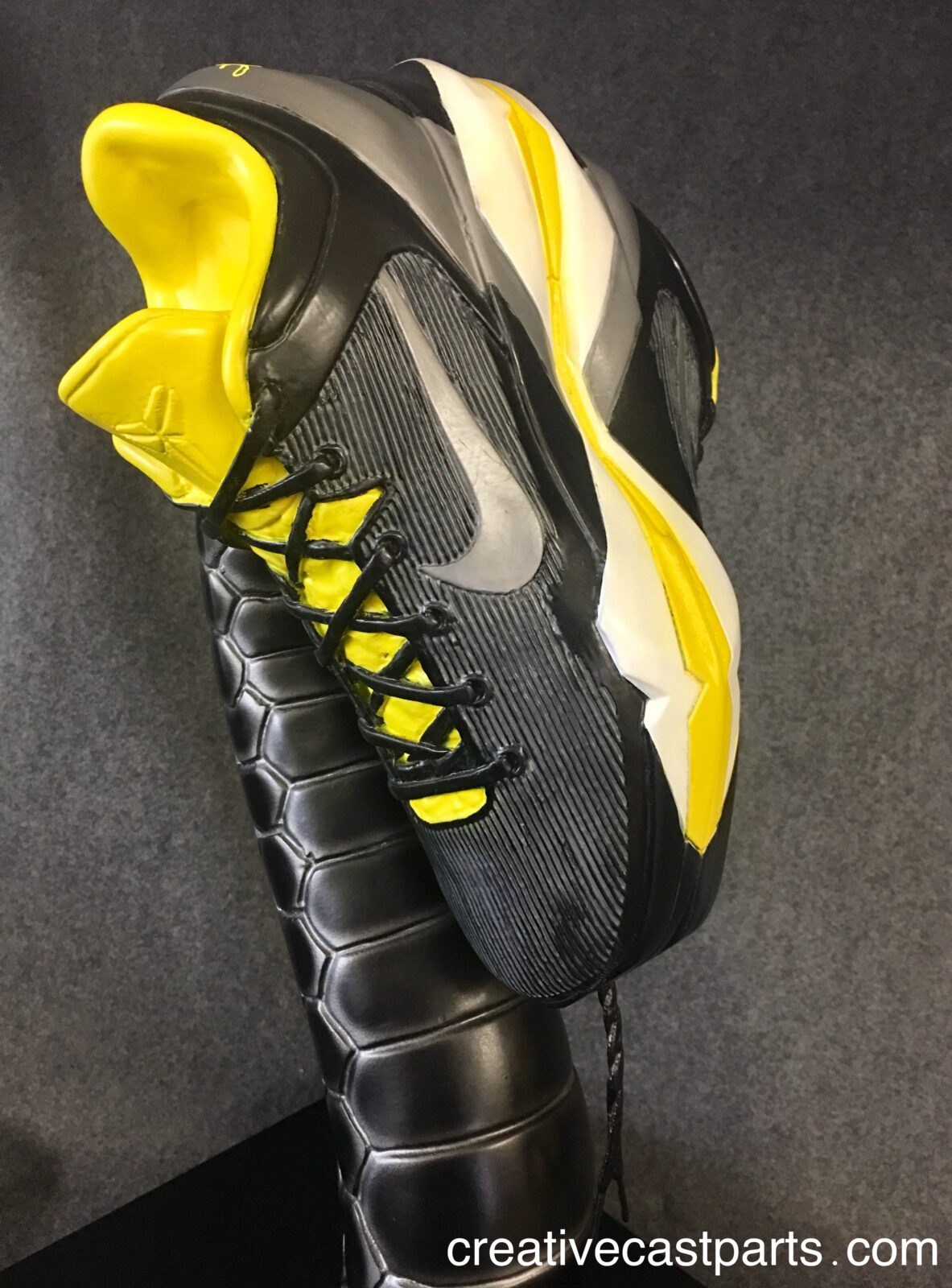 Acrylic Nike Kobe VII System display stand designed for promotional retail sneaker presentations.